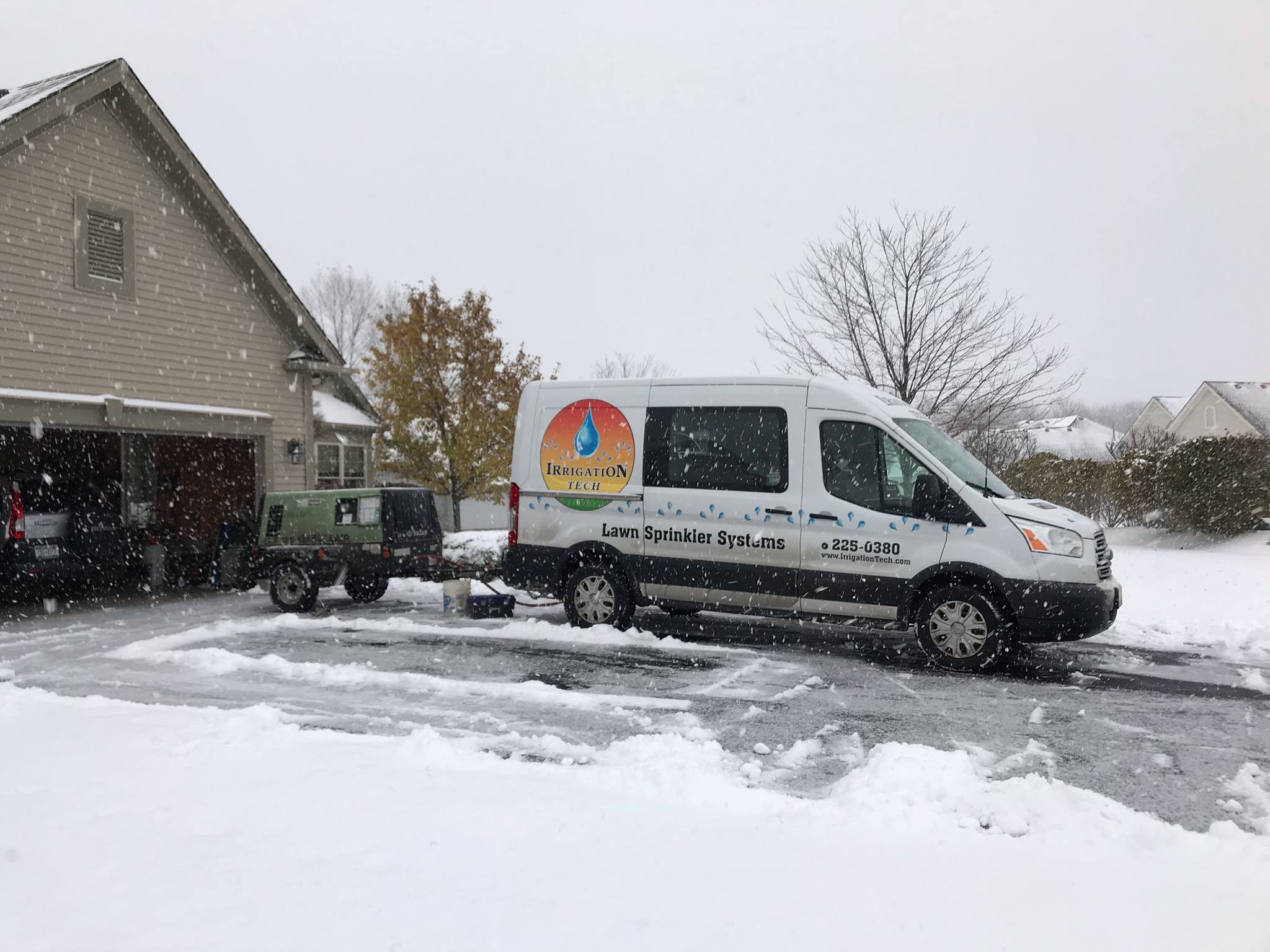 White irrigation tech van in snow